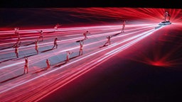 Rote Lichtstrahlen schießen über den Boden ausgehend vom Läufer © imago images/GEPA pictures Foto: Harald Steiner